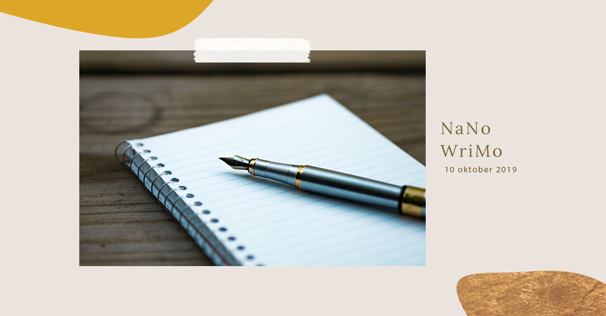 pen laying on top of a writing book